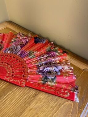 Red background floral design Style Hand Fan with gold tone accents 15 “ across